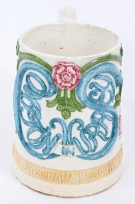 Lot 96 - A Compton Pottery mug with silver shape handle.