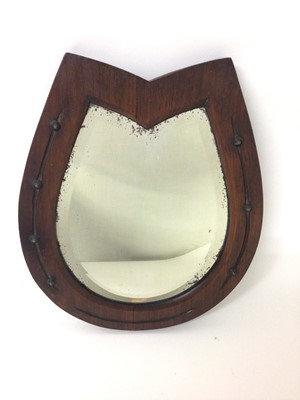 Lot 1417 - Edwardian mahognany bevelled glass mirror in the shape of a horse shoe
