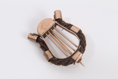 Lot 838 - 19th century yellow metal mounted hair work brooch in the form of a lyre