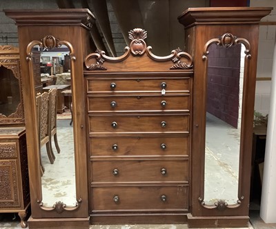 Lot 1333 - William IV mahogany wardrobe with mother of pearl inlaid 
handles, six central graduated drawers flanked by two hanging 
cupboards with mirror doors.