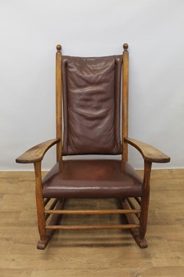 Lot 1322 - Arts and Crafts fruitwood country rocking elbow chair with leather 
upholstery.