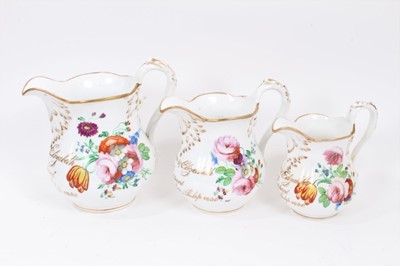 Lot 94 - Three graduated Staffordshire porcelain jugs named and 
dated 1856.