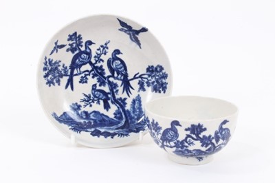 Lot 3 - A Worcester blue and white tea bowl and saucer, circa 1770-85, printed with the Birds in Branches pattern, crescent marks to bases, the saucer measuring 12cm diameter