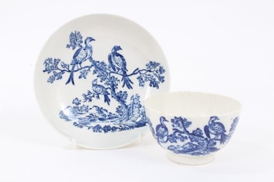Lot 4 - A Worcester blue and white tea bowl and saucer, circa 1770-85, printed with the Birds in Branches pattern, crescent marks to bases, the saucer measuring 12.5cm diameter