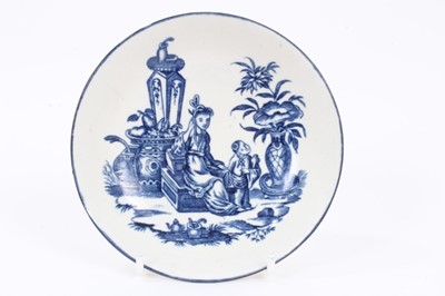 Lot 7 - A Worcester blue and white tea bowl and saucer, circa 1775-85, printed with the Mother and Child pattern, the saucer blue-lined and measuring 12.5cm diameter