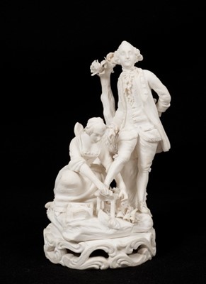 Lot 346 - A Derby bisque 'shoe black' group, late 18th/early 19th century, incised model number 81 to base, 18cm high
