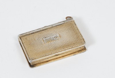 Lot 256 - A Georgian silver gilt vinaigrette in the form of a book.