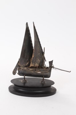 Lot 517 - Continental silver model of a boat, on oval stand, the model marked 800, 18.8cm in height (including stand).