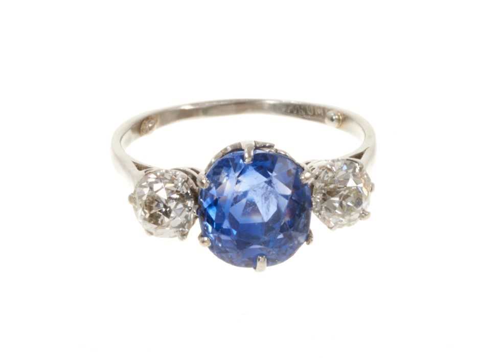 Lot 408 - A fine sapphire and diamond three stone ring