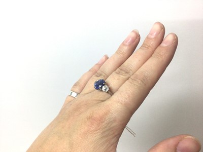 Lot 408 - A fine sapphire and diamond three stone ring