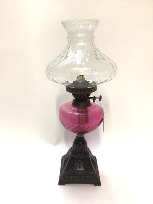 Lot 2455 - Oil lamp with cranberry reservoir