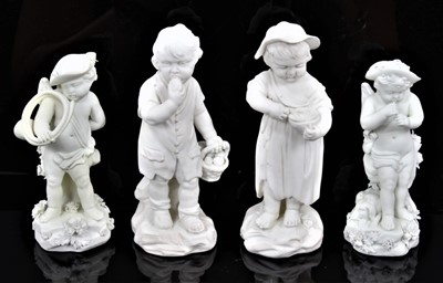 Lot 54 - A small pair of Derby bisque children, late 18th/early 19th century, the boy eating an apple from a basket at his side, a barefoot girl tucking into a bowl of curds and whey, incised number 101, 12...