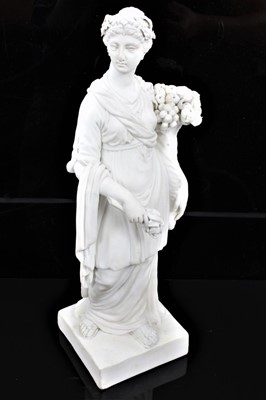 Lot 59 - A Derby bisque figure emblematic of Plenty, late 18th/early 19th century, shown robed and carrying a cornucopia of fruit, incised model number 163, 24.5cm high