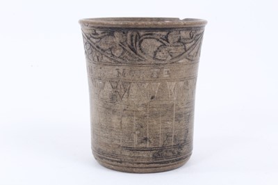 Lot 137 - An unusual antique earthenware beaker, inscribed 'PIERRE DE LA MER - MORTE', with incised foliate patterns, 8cm high