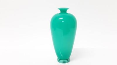 Lot 1381 - Antique turquoise glass vase with trailed foot, (turquoise glass cased over opaque glass)
