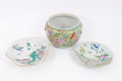 Lot 150 - A 19th century Chinese Straits-style famille rose porcelain bowl, painted with flowers, with lugs for handles, together with two 19th cenutry Chinese famille rose dishes (3)