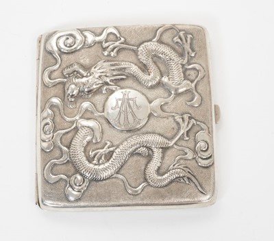 Lot 347 - Late 19th/early 20th century Chinese white metal cigarette case, the cover with raised Dragon decoration and engraved initials, the rear decorated with bamboo and a bird, silver gilt interior, appa...