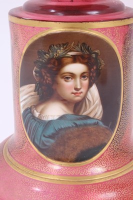 Lot 152 - A late 19th century Bohemian cranberry glass centrepiece, the circular bowl with gilt Greek Key pattern, above a pedestal base with gilt patterns and oval painted portrait of a young woman, 33.5cm...