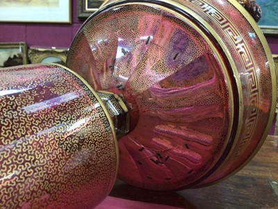 Lot 152 - A late 19th century Bohemian cranberry glass centrepiece, the circular bowl with gilt Greek Key pattern, above a pedestal base with gilt patterns and oval painted portrait of a young woman, 33.5cm...