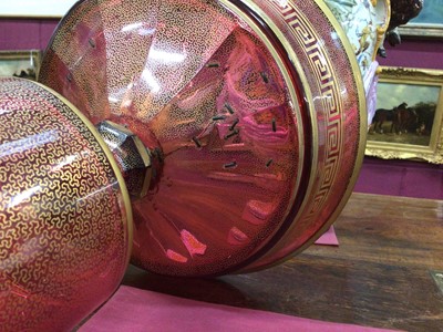 Lot 152 - A late 19th century Bohemian cranberry glass centrepiece, the circular bowl with gilt Greek Key pattern, above a pedestal base with gilt patterns and oval painted portrait of a young woman, 33.5cm...
