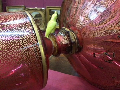 Lot 152 - A late 19th century Bohemian cranberry glass centrepiece, the circular bowl with gilt Greek Key pattern, above a pedestal base with gilt patterns and oval painted portrait of a young woman, 33.5cm...