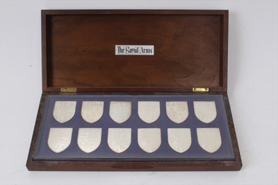 Lot 108 - Set 12 silver Royal Coats of Arms shields in fitted case and two framed silver Silver Jubilee 1977 medallions
