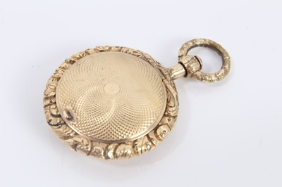 Lot 579 - Regency yellow metal vinaigrette of circular form with cast foliage and engine turned decoration, 40mm x 26mm.