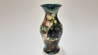 Lot 1108 - Moorcroft pottery trial vase decorated in the Hellebore pattern by Nicola Slaney, painted by Sue Barnsley, dated 4.4.00, 19cm high
