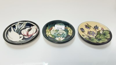 Lot 1119 - Three Moorcroft coasters/pin dishes to include Lamia pattern signed by Rachel Bishop and Hepatica pattern signed by Emma Bossons