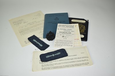 Lot 817 - 1950's RAF certificate of service named to Leading Aircraftman Roy Stuart Swann together with passport, badges and photograph.