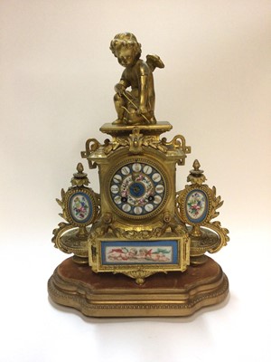 Lot 2434 - 19th century French gilt metal clock with porcelain panels.