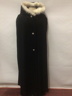 Lot 2065 - Black corduroy opera cloak with three fancy buttons and a hood.  Black velvet fitted evening jacket with braid trimmed edges size 16,  a pink woven silk jacket with gilt buttons and a pink leather...