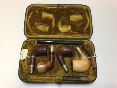 Lot 2404 - Leather cased set of four pipes (two Meerschaum and two briar), silver mounted and hallmarked Birmingham 1898