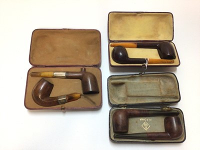 Lot 2406 - Three cases of two briar pipes, the first with one hallmarked 1899, the second unmarked with amber stems, the third by BBB (Brumfield Best Briars)