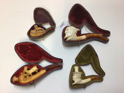 Lot 2407 - Four cased Meerschaum pipes, including Lucifer, a lion, a deer, and a woman