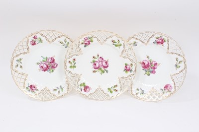 Lot 237 - Set of three Minton plates with pierced borders and polychrome painted with floral sprays