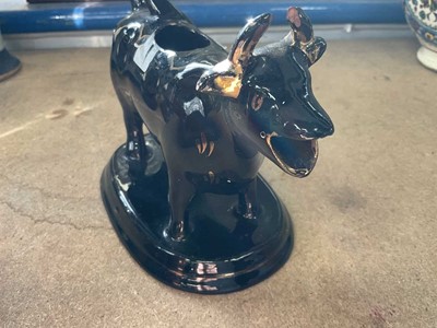 Lot 187 - Victorian treacle glazed cow creamer