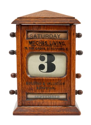 Lot 926 - Early 20th century oak advertising desk calendar