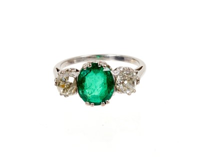 Lot 625 - Emerald and diamond three stone ring