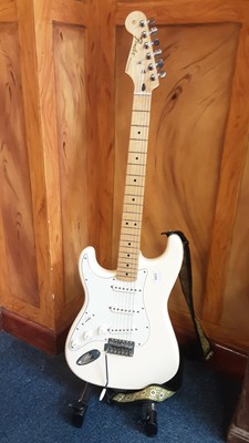 Lot 2260 - Fender Stratocaster left-handed electric six string guitar, official contour body in white/cream , model number 15636022 , made in Mexico. 
£250/350