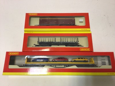 Lot 246 - Hornby OO gauge rolling stock including BR Carflat Car Transporter (x5), R6143, EWS closed van (x3), R6042A, BR Bogie Bolster A (x4), R6123, plus nine other wagons, all boxed (22)