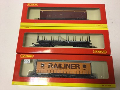 Lot 247 - Hornby OO gauge rolling stock including Railiner curtain sided wagon (x5), R6187, EWS closed van (x2), R6042A, BR Bogir Bolster A, R6123, assorted wagon set, R6228, plus six other wagons, all boxed...
