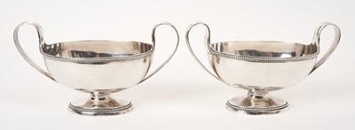 Lot 401 - A pair of Georgian armorial silver sauce tureens.