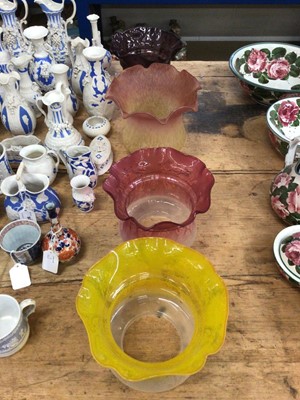 Lot 30 - Four Edwardian frosted and tinted glass oil lamp shades