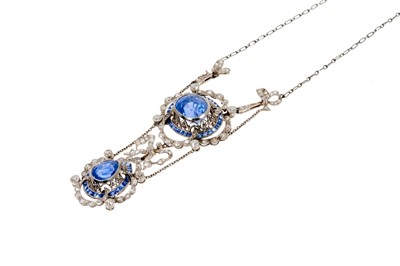 Lot 620 - Fine early 20th century Belle Époque sapphire and diamond necklace, the principal oval mixed cut cornflower blue sapphire estimated to weigh approximately 8.40 carats, in millegrain collet setting...