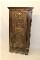 Lot 1120 - Continental Carsved oak cupboard, applied...