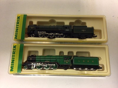 Lot 4 - Minitrix N gauge locomotives including Flying Scotsman 4-6-0 12949, Evening Star 2-10-0 12041, plus three others and a selection of carriages and rolling stock (qty)