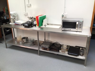 Lot 7 - A wall standing stainless steel preparation with under shelf, 2800 mm
