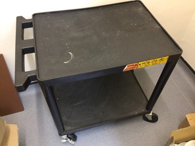 Lot 18 - A black plastic two tier tea trolley, on castors, 610 mm x 460 mm