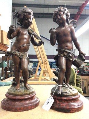 Lot 413 - Pair of spelter cherub ornaments, 36cm high